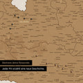 Detail einer Österreich-Karte als Pinn-Leinand in Bronze mit Pins im Salzburger Land und Kärnten