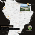Dettaglio di una mappa del mondo magnetica come lavagna magnetica in bianco e nero che mostra il Sud America con una foto appuntata e magneti da viaggio e vacanza