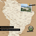 Dettaglio di una mappa del mondo magnetica come lavagna magnetica in Treasure Gold che mostra il Sud America con una foto appuntata e magneti da viaggio e vacanza